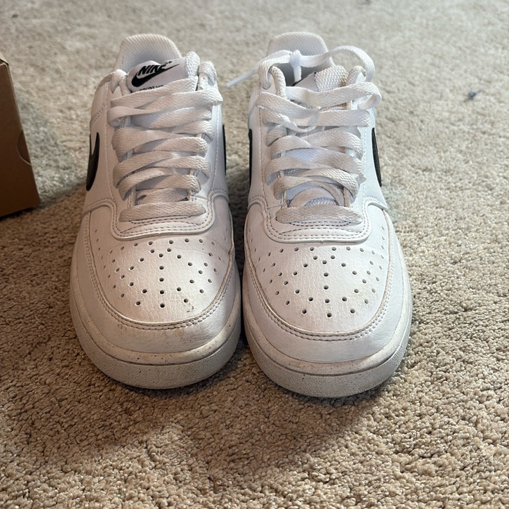 White and black ,Nike sneakers, slightly worn